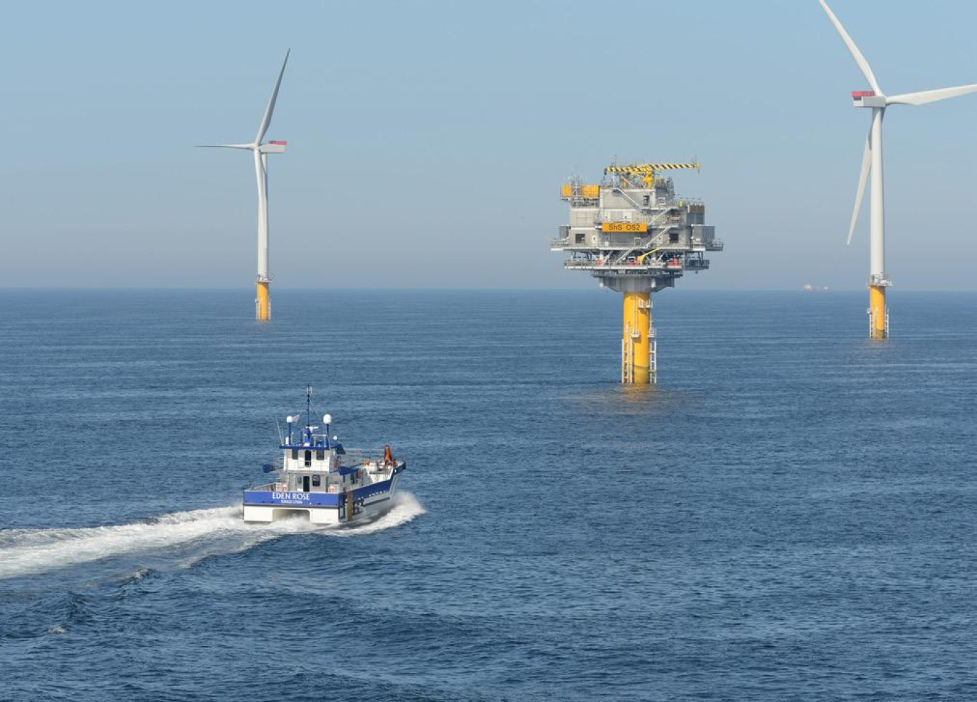 Crew transfer vessel (CTV) carrying crew and equipment to an offshore wind farm